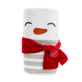 White and cream knit blanket with the face of a snowman rolled with the face on the outside and tied with a red scarf, with a product tag attached.