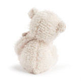Back view of a fuzzy plush cream bear holding a light brown baby plush bear.