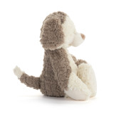 Right profile view of a cream and brown plush puppy.