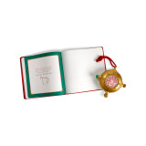 A gold ornament that looks a bit like a compass on a red hanger. There is a QR code in the center to scan for videos, displayed next to a red bound journal that says "Santa's Kindness Journal", displayed open to show inner pages. A gold ornament that looks a bit like a compass on a red hanger. There is a QR code in the center to scan for videos, displayed next to a red bound journal that says "Santa's Kindness Journal", displayed open to show inner pages.