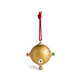 Back view of a gold ornament that looks a bit like a compass on a red hanger. There is a QR code in the center to scan for videos.