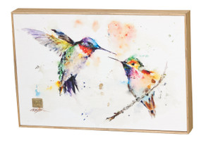 White wall art with multi-colored hummingbirds printed on