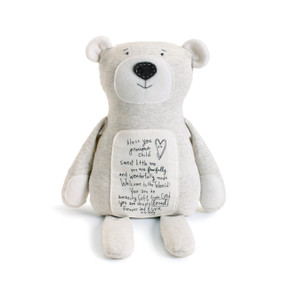 White bear with brown nose has a note on his tummy in black lettering. He sits facing camera