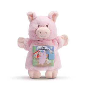 Small pink stuffed pig standing up with 'this little piggy' cloth story book on its tummy