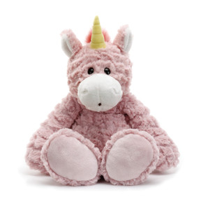 Stuffed light pink unicorn animal sitting up so bottom of feet are showing - horn is yellow