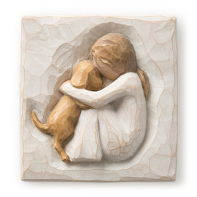 Flat square cream-colored plaque with bas-relief carving of seated girl holding golden dog