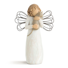Front view of female in cream dress with wire wings, holding gray cat in her arms