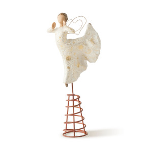 Left view of angel wearing cream dress with gold accents and carved with celestial designs elevated on wire spiral frame in ballet pose with hands held as if singing
