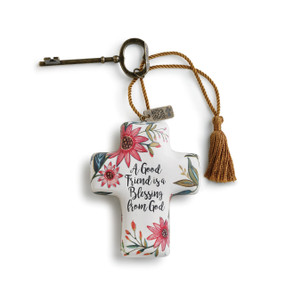 A good friend is a blessing from God' printed on white cross with pink/green flower print keychain