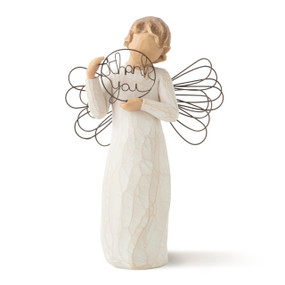 Front view of standing female figure in cream dress with wire wings, holding thank you" written in wire inside wire circle"