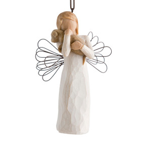 Female angel figure in cream dress with wire wings, holding brown dog in arms, ornament loop attached to head