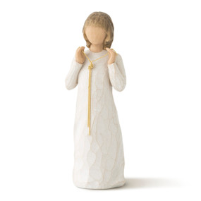 Front view of standing female figure in cream dress, holding a long, gold, knotted chain between her hands