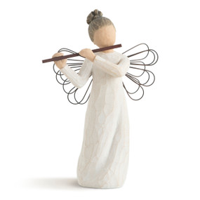 Front view of female figure in cream dress with wire wings and hair in bun, playing the flute