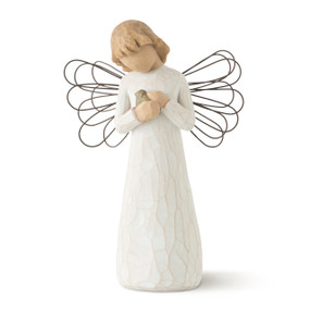 Front view of female angel figure in cream dress with wire wings, holding blue-gray bird in hands