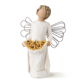 Front view of standing female angel with wire wings and wavy hair, holding up skirt filled with yellow flowers