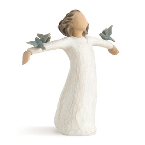 Front view of standing female in cream dress with arms outstretched, with three bluebirds perched on outstretched arms