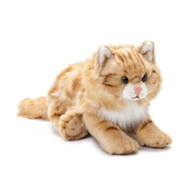 Close up of front view of stuffed tan cat laying down
