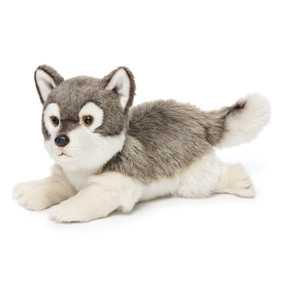 Two stuffed white/grey dogs laying facing forward