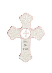 White cross figurine with light pink details - 'bless this child' in black letters