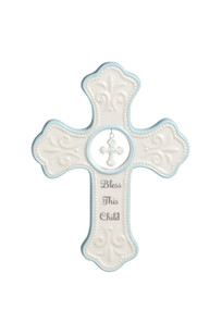 White cross figurine with light blue details - cross in the center' 'bless this child' in black letters