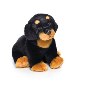 Stuffed sitting black and orange dog