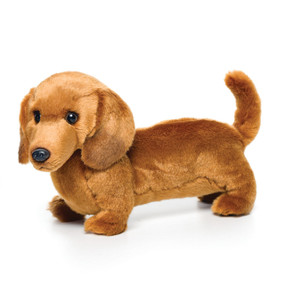 Side view of long golden stuffed dog animal