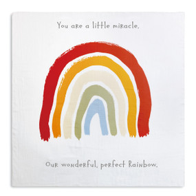 White cloth with you are a little miracle in grey letters above rainbow print, our wonderful, perfect rainbow in grey letters