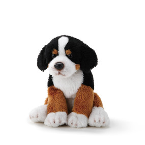 White/black/brown sitting up stuffed dog animal
