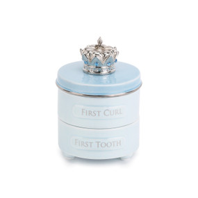 Small white jar with 'first curl' and 'first tooth' carved in - top of jar is light blue with a silver crown on top