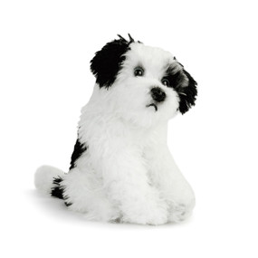 stuffed black and white dog in sitting position