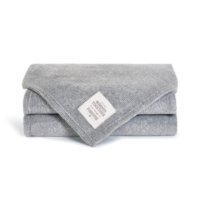 blue and white fuzzy blanket folded up