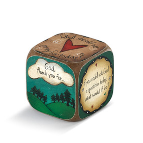 Brown/blue/green cube with 'god thank you for...' visible on one side