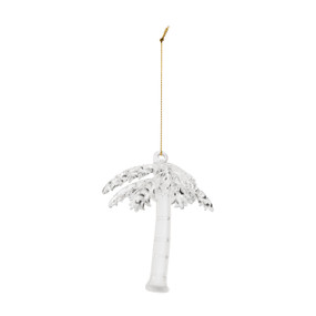 A glass palm tree ornament hanging by a gold thread.
