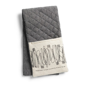 A gray double oven mitt with cream fabric ends that say "Together is Our Favorite Place to Be" underneath line drawings of utensils, displayed folded in half.