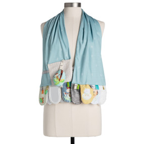 A light blue scarf with tabs at each end with different sensory toys for baby in a jungle theme, displayed on a mannequin.