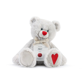 A fluffy white plush bear with a red nose, red heart, and a white product tag that reads "Friendly July".