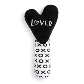 A black and white rattle with "xoxo" on the base and a black heart top that reads "loved".