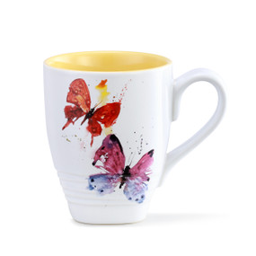 A yellow and white coffee mug with a flock of butterflies painted on the front.