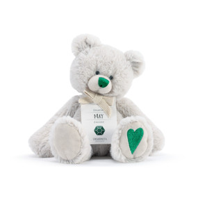 A fluffy white plush bear with a green nose, green heart, and a white product tag that reads "Dreamer May".