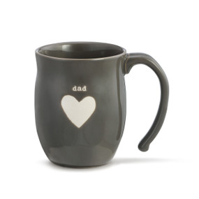 A dark gray coffee mug with "dad" engraved above a white heart.