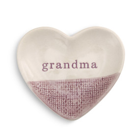 A small ivory and purple textured dish with "grandma" engraved.