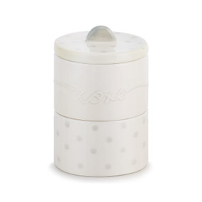 A ceramic white "First Tooth/Curl" container with gray polka dots.