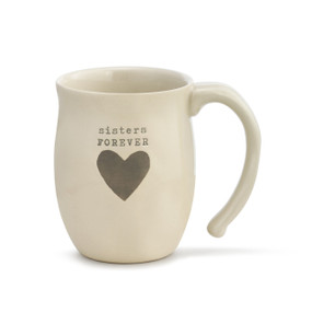 An ivory coffee mug with "sisters forever" engraved above a brown heart.