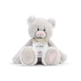 A fluffy white plush bear with a pink nose, pink heart, and a white product tag that reads "Playful October".