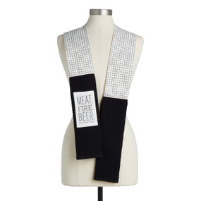 A black and white check fabric kitchen boa with black towel ends and a white fabric patch that says "Meat. Fire. Beer. (It's a guy thing)" displayed on a mannequin.