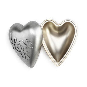 Metal trinket box in a heart shape with the words I Love us