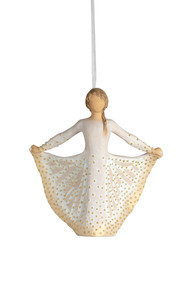 Front view, figure in cream dress, holds skirt with both hands, carved like monarch, dotted with gold. Hook, loop on ornament's head