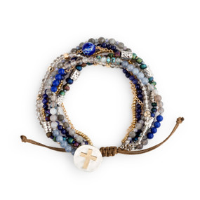 A beaded bracelet set with various gold, silver, blue and green beads and a cross clasp.