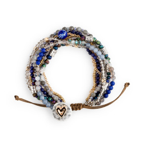 A beaded bracelet set with various gold, silver, blue and green beads and a heart clasp.