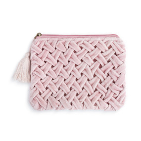 A soft velvet pink zip pouch with a pink tassle.